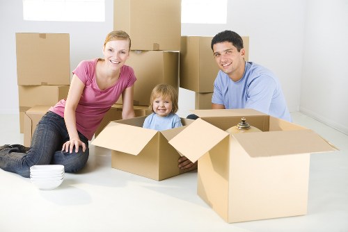 Staff using careful lifting techniques with removal boxes
