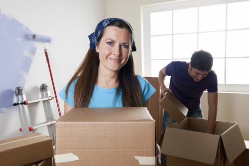 Team using correct manual handling techniques during a move