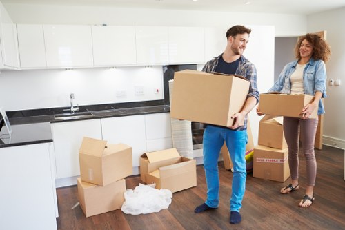 Packed boxes and furniture ready for urgent removal service