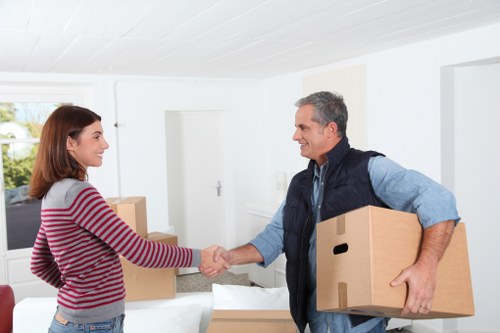 Professional movers loading boxes for a student relocation in southwest London
