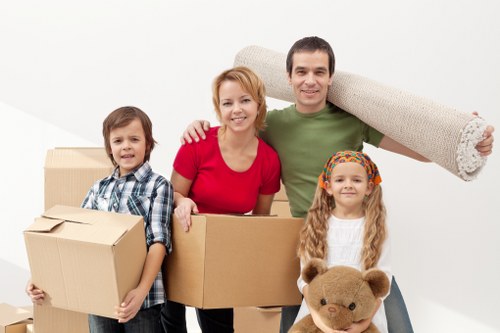 Unloading furniture and boxes from a removal van at a new property