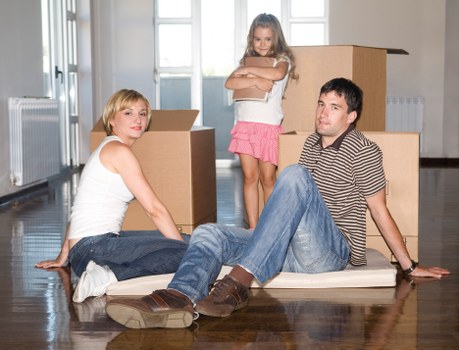 Loading furniture into a removal truck for a home relocation